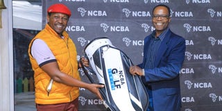 NCBA Group Managing Director John Gachora awards Kenneth Mburu,