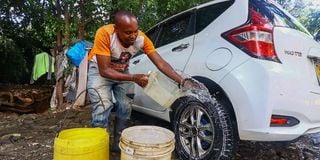 James Kituku at his car wash business on Dennis Pritt Road in Nairobi.