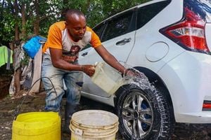 James Kituku at his car wash business on Dennis Pritt Road in Nairobi.