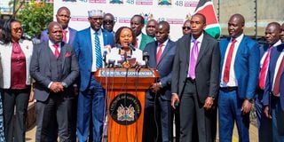 Council of Governors chairperson Anne Waiguru (centre) with her colleagues during a media briefing in Nairobi