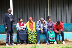Nairobi Governor Johnson Sakaja sits with supporters and voters